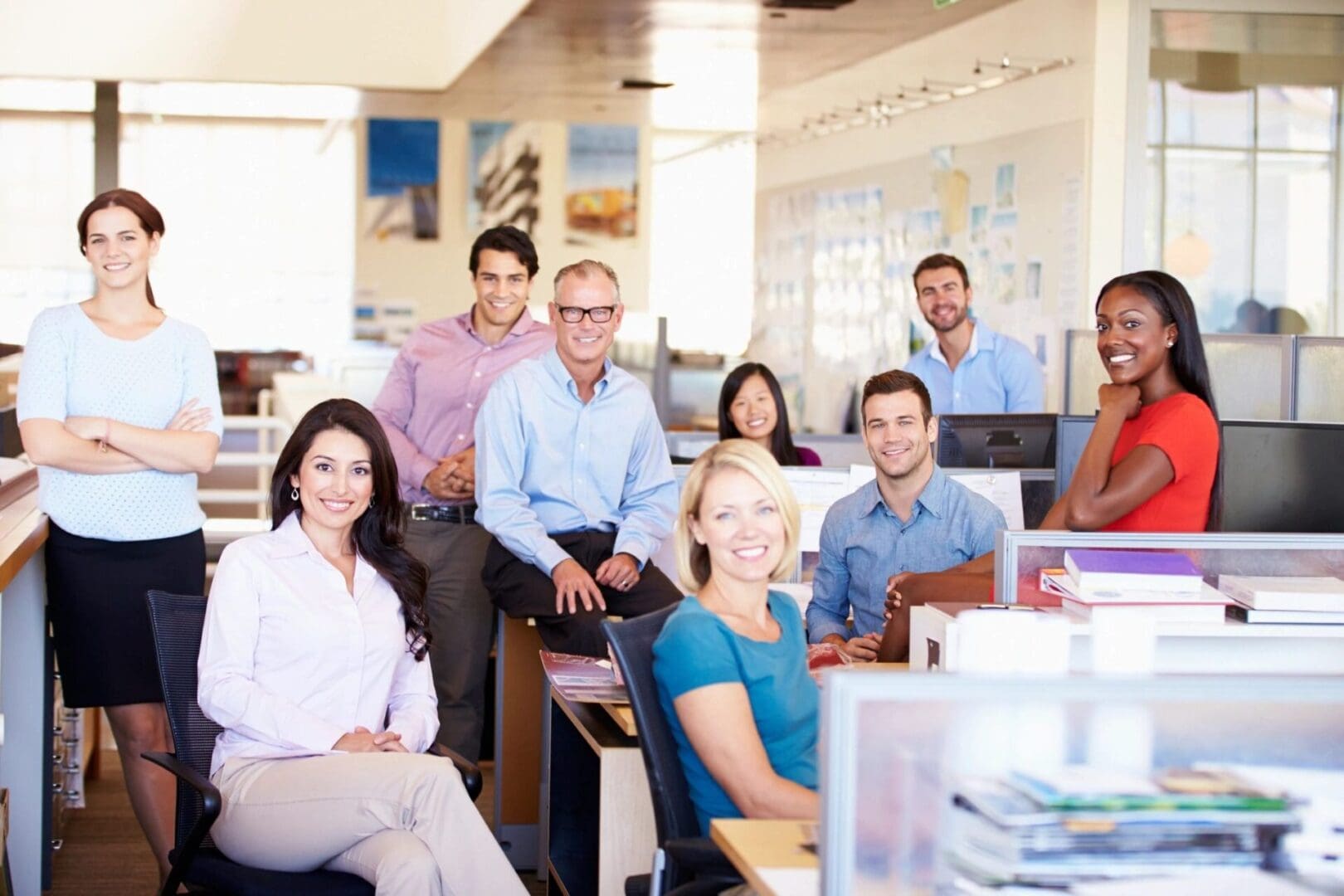 A group of people sitting in an office.